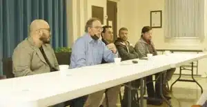 afghan refugees talk with members of the community